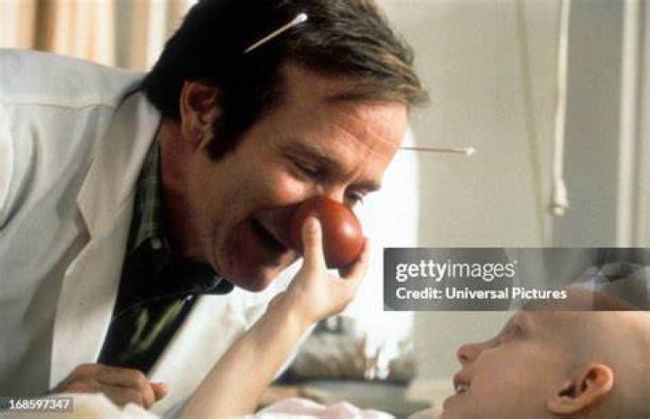 Robin Williams visits a sick child in a scene from the film 'Patch Adams', 1998. (Photo by Universal/Getty Images)
